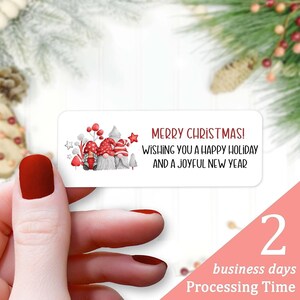 May include: A white sticker with three gnomes wearing red hats and white beards. The sticker says "Merry Christmas! Wishing you a happy holiday and a joyful new year".