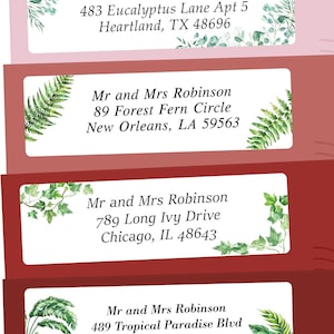 May include: Four address labels with floral and botanical designs. Each label features the text "Mr. & Mrs. Robinson" followed by a different address. The labels are set against a gradient background of pink and burgundy.