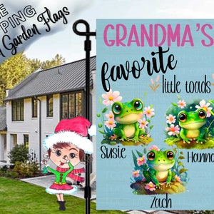 May include: A blue garden flag with the text "Grandma's favorite little toads" and three cartoon frogs with the names Susie, Hannah, and Zach.