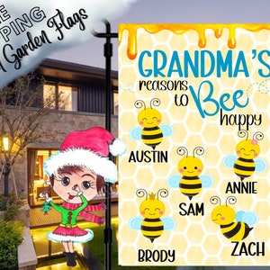 May include: A personalized garden flag with the text "GRANDMA'S reasons to Bee happy" and the names Austin, Annie, Sam, Zach, and Brody. The flag features cartoon bees on a yellow honeycomb background. The words "FREE SHIPPING Custom Garden Flags" are also visible.