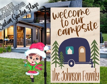 May include: Welcome to our campsite sign with a blue camper, green trees, and the text "The Johnson Family".
