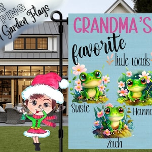 May include: A blue and pink garden flag with the text "Grandma's favorite little toads" and three cartoon frogs with the names Susie, Hannah, and Zach.