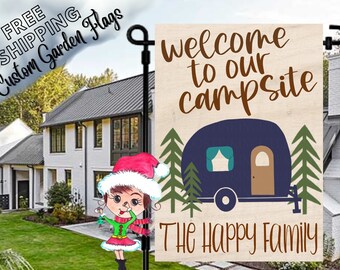 May include: Welcome to our campsite sign with a blue camper, green trees, and the text "The Happy Family".