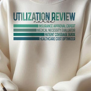 May include: Cream-colored sweatshirt with the text "UTILIZATION REVIEW nurse" in teal and green. Below the text are the phrases "INSURANCE APPROVAL EXPERT", "MEDICAL NECESSITY EVALUATOR", "PATIENT COVERAGE GUIDE", and "HEALTHCARE COST OPTIMIZER".