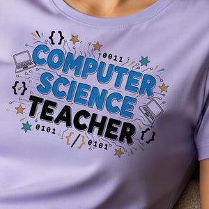 May include: A light purple t-shirt with the words "COMPUTER SCIENCE TEACHER" in blue and black, with laptop and binary code graphics. The shirt is a crew neck style.