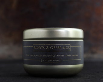 ROOTS & OFFERINGS - Small Scented Candle In Gold Tin - Woods And Resins