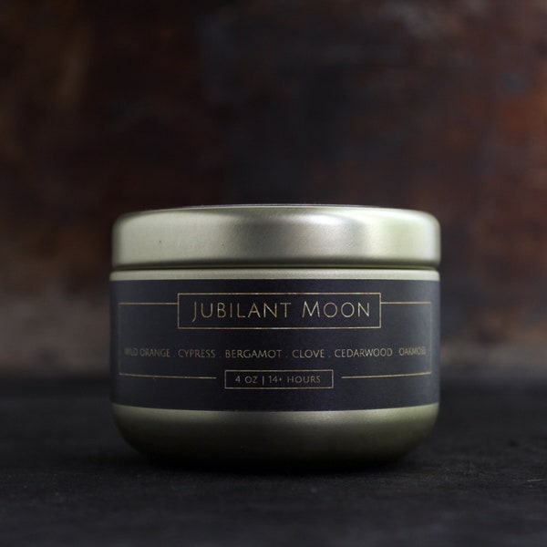 JUBILANT MOON - Small Scented Candle In Gold Tin - Woodsy Citrus