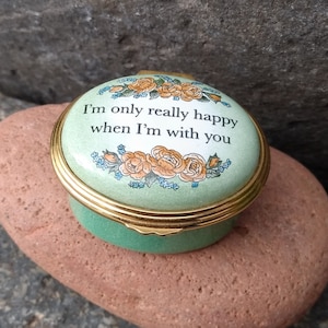 May include: A green and gold trinket box with a floral design and the text "I'm only really happy when I'm with you".
