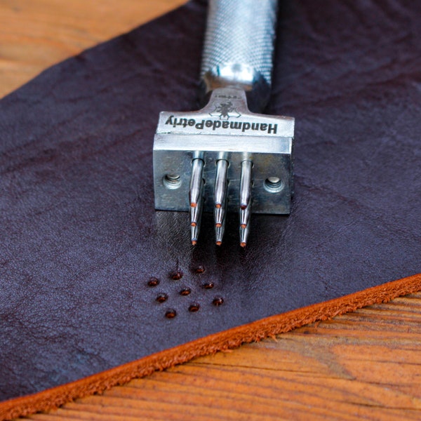 manual leather punch with nine holes of 0.04 inch diameter