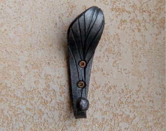 Handmade metal forged hook in the form of a leaf