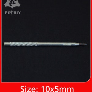May include: A silver metal tool with a textured handle and a pointed tip. The tool is 3.9 inches long and 1.9 inches wide. Size: 10x5mm.