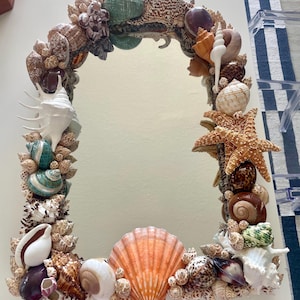 May include: A set of three ceramic mugs with a speckled, matte finish. The mugs are in shades of cream, light gray, and dark gray. Each mug has a simple, minimalist design, perfect for coffee or tea.