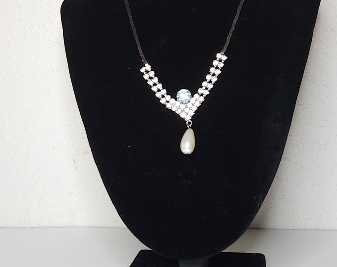 Vintage Silver Tone V-Shaped Necklace with Clear Rhinestones, Pale Blue Rhinestone, and Faux Pearl Teardrop B-3-38