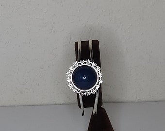 Vintage Silver Tone Hinged Cuff Bracelet with Blue Round Cabochon and Floral Border D-2-39