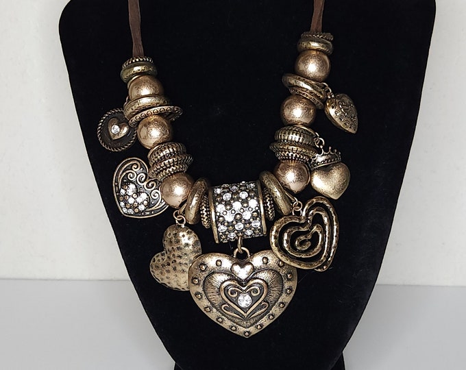 Vintage Three Strand Brown Faux Suede Necklace with Large Gold Tone Heart Pendants and Textured Beads B-2-69