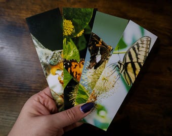 May include: Four colorful bookmarks featuring close-up images of butterflies and flowers. The bookmarks are made of sturdy cardstock and are perfect for marking your place in a book.