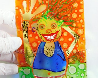 May include: A stained glass artwork featuring a cartoon character with green hair, a blue tank top, and brown boots. The character is waving with a big smile and is set against a background of orange and green circles.