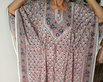 May include: A long, flowing pink and blue kaftan with a floral print and a drawstring waist.