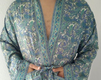 May include: A blue and green paisley patterned robe with a long sleeve and a sash tie.