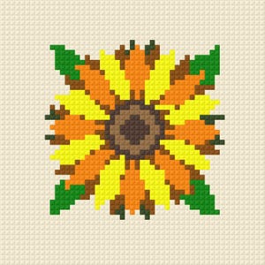May include: A cross-stitch pattern of a sunflower featuring a dark brown center, alternating yellow and orange petals, and green leaves. The design is rendered in a pixelated style on a light cream-colored fabric background with a visible grid texture.