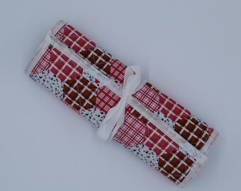 Make up brush travel roll handcrafted from a patchwork print fabric