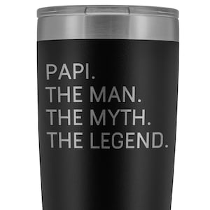 May include: Black stainless steel tumbler with a white inscription that reads "Papi. The Man. The Myth. The Legend."