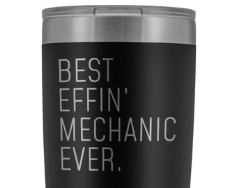 May include: Black insulated travel mug with a silver lid. The text "BEST EFFIN' MECHANIC EVER" is printed in silver. The mug has a ridged design near the base. Ideal for mechanics.
