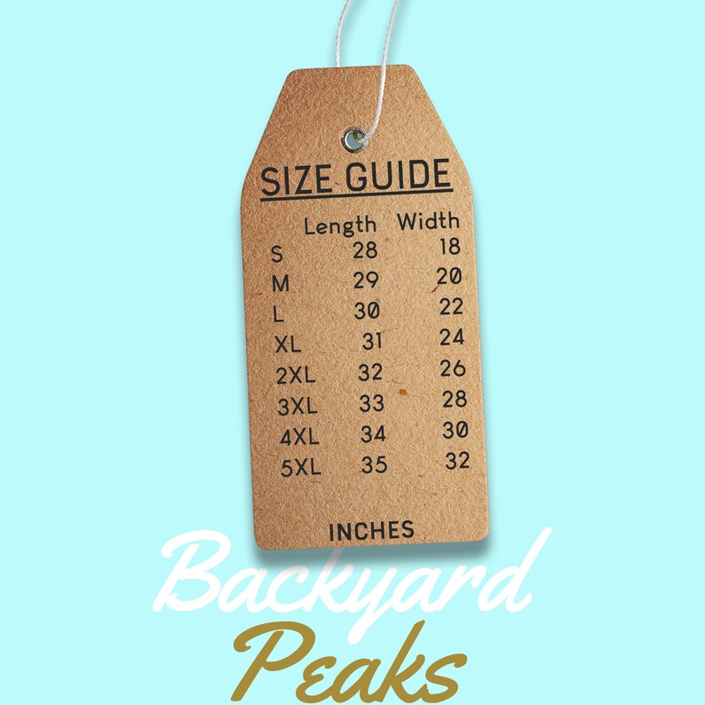 May include: A brown paper size guide tag with the text "SIZE GUIDE" and a chart listing sizes S through 5XL with corresponding length and width measurements in inches. The tag is labeled "Backyard Peaks" in gold lettering.