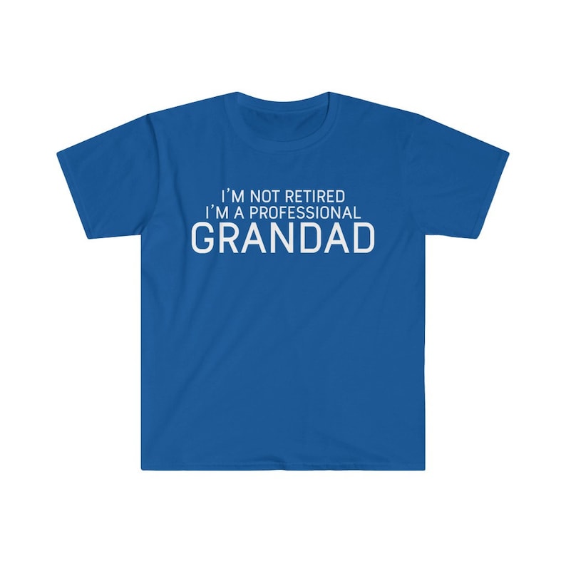 May include: A royal blue t-shirt with white text that reads "I'm not retired I'm a professional Grandad".