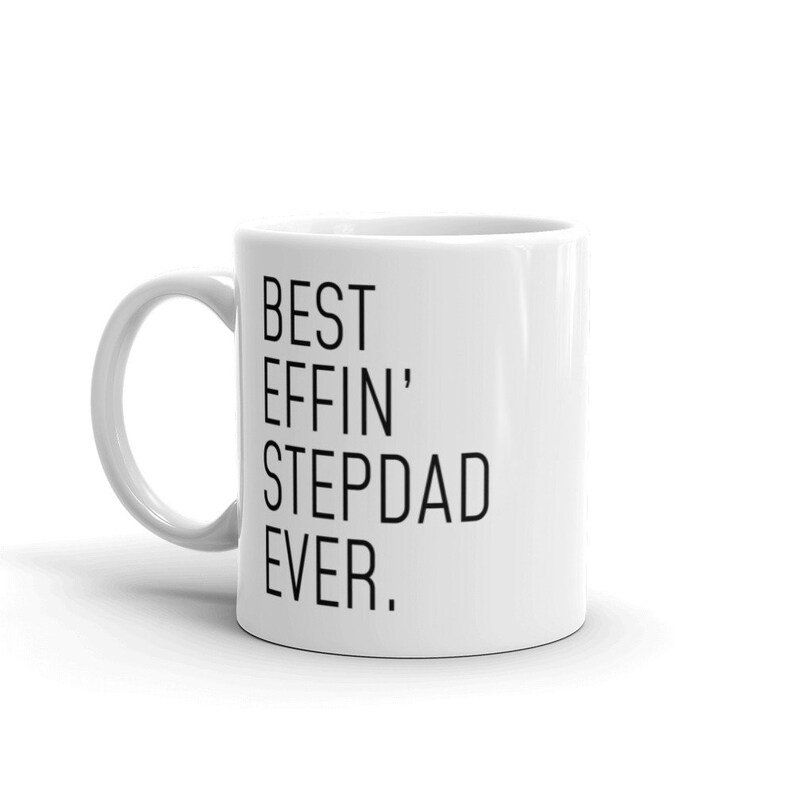 May include: White ceramic coffee mug with black text that reads "BEST EFFIN' STEPDAD EVER."