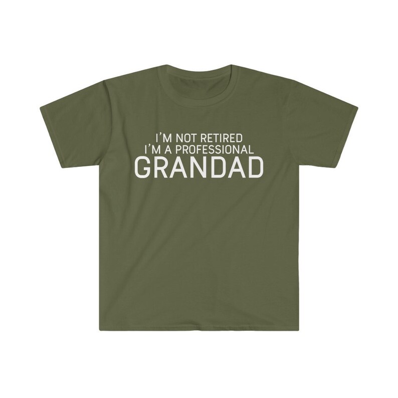 May include: A green t-shirt with white text that reads "I'm not retired I'm a professional Grandad".