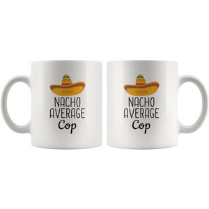 May include: Two white ceramic mugs with a black and white graphic of a sombrero and the text "Nacho Average Cop".