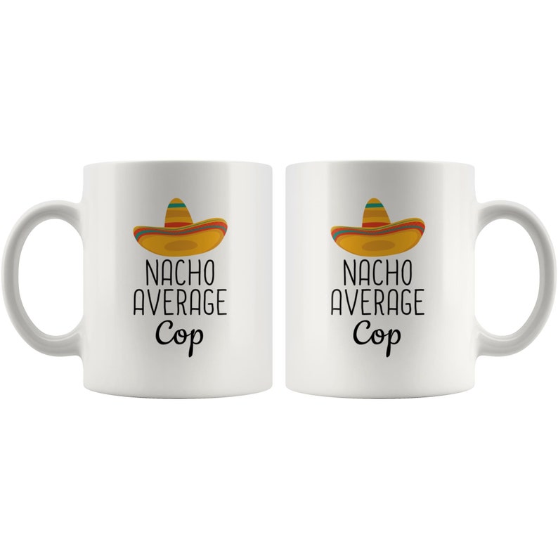 May include: Two white ceramic mugs with a black and white graphic of a sombrero and the text "Nacho Average Cop".
