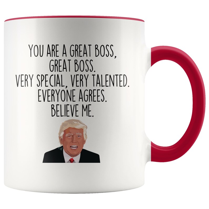 May include: White coffee mug with a red rim and handle. The mug features a black and white illustration of Donald Trump and the text "You are a great boss, great boss. Very special, very talented. Everyone agrees. Believe me."