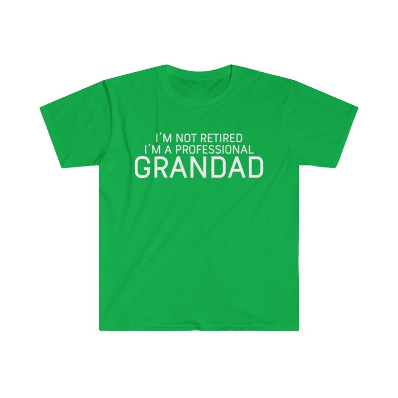 May include: Green t-shirt with white text that reads "I'm not retired I'm a professional Grandad."