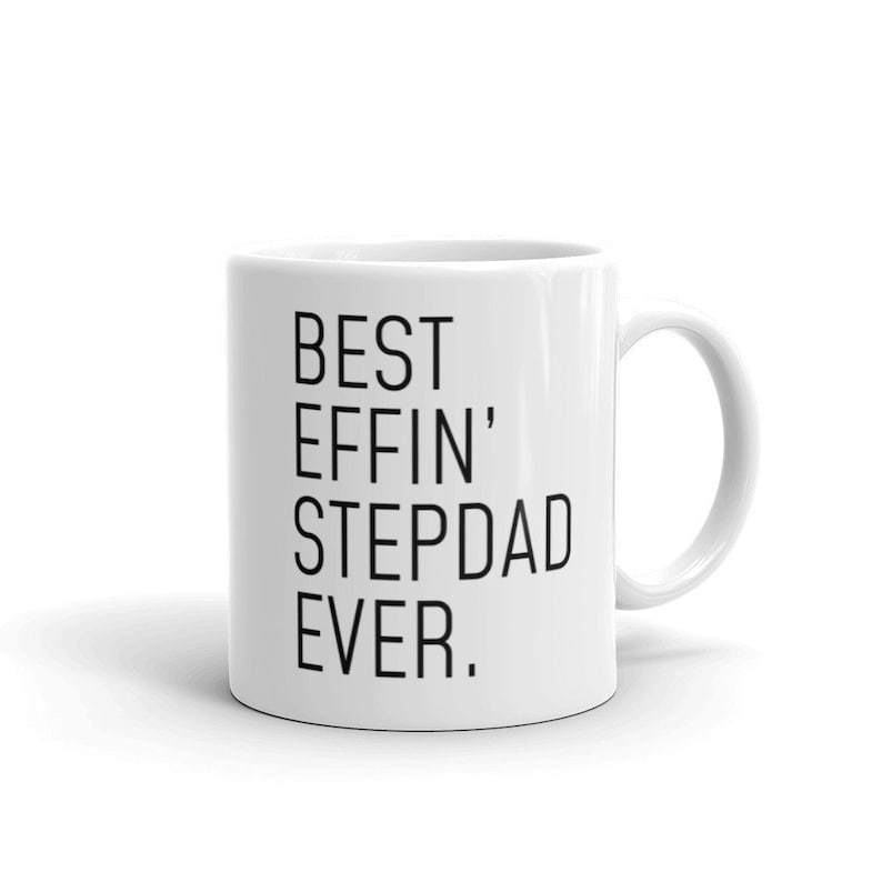 May include: White ceramic coffee mug with black text that reads "BEST EFFIN' STEPDAD EVER."