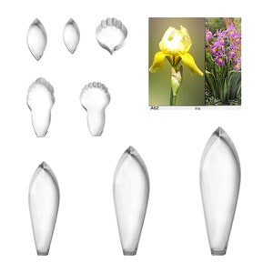 May include: Set of 7 stainless steel flower cutters for making irises. The cutters are in various sizes and shapes, including petals, sepals, and a centre piece. The set includes a photo of a yellow iris flower and a purple iris flower.