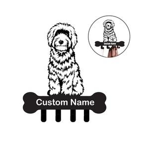 May include: Black and white silhouette of a dog sitting on a bone-shaped coat rack with four hooks. The rack has the text "Custom Name" on it.