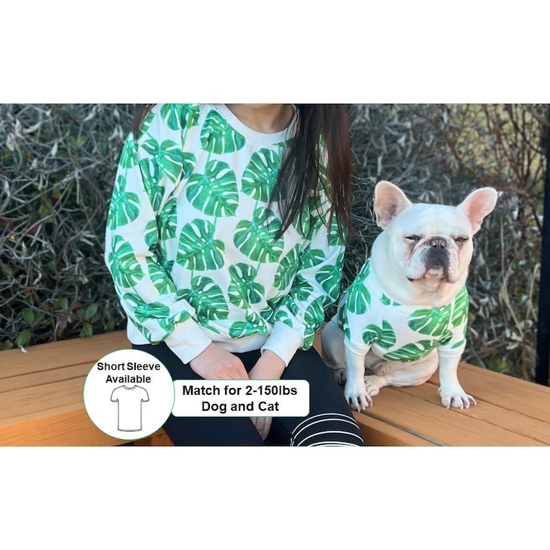 May include: A white sweatshirt with a green tropical leaf print for people and a matching dog shirt. The text "Match for 2-150lbs Dog and Cat" is on the image. A smaller image of a short-sleeve t-shirt is in the corner with the text "Short Sleeve Available".