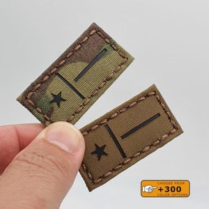 May include: Two embroidered patches with a black star and a black bar. The patches are on a camouflage fabric and a brown fabric. The text on the image reads "Choose from +300 Colour Options".