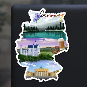 May include: A sticker shaped like the outline of Germany with various images of German landmarks and culture. The sticker features a lake, a castle, a pretzel, a beer stein, and the Brandenburg Gate. The text "Germany" is written in a stylized font at the top of the sticker.