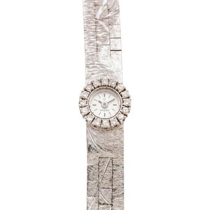 Ladies&#39; OMEGA 18K White Gold Swiss-Made Dress Watch with Diamond Bezel.