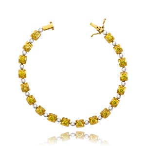 Estate 18K Yellow and White Gold Fancy Yellow Diamond Tennis Style Bracelet.