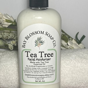 May include: A white bottle of Bay Blossom Soap Co. Tea Tree Facial Moisturizer. The label includes the product name, ingredients, and the Etsy shop's URL. The bottle has a black cap and contains 4 oz of product.