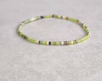 11/0 Single Irish Petals tiny stretch stackable seed bead bracelet, shades of green, transp citrine, bronze ab, white seed bead bracelet