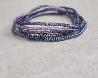 11/0 Diva tiny stretch seed bead bracelet set, stackable dainty stretch seed bead bracelet set, shades of purple, black diamond ab, gunmetal