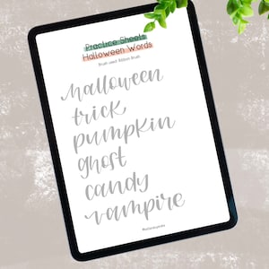 May include: A digital tablet screen displaying a practice sheet for writing Halloween words. The words are written in a grey, cursive font. The words are: "Halloween", "trick", "pumpkin", "ghost", "candy", and "vampire".