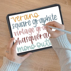 May include: A digital tablet with a white screen displaying handwritten text in various colors. The text includes "verano", "square graphite", "vintage gra", "masquerad", and "mono out".