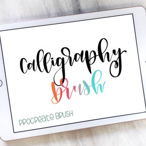 May include: A white tablet screen displaying the text "calligraphy brush" in black cursive lettering. The word "brush" is written in a rainbow gradient of red, orange, yellow, green, blue, and purple. The text "PROCREATE BRUSH" is written in green at the bottom of the screen.