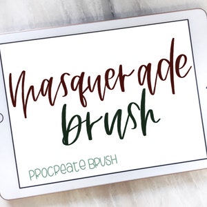 May include: A white tablet screen displaying the text "Masquerade brush" in a dark red and dark green font. The text "Procreate Brush" is displayed in a light green font at the bottom of the screen.